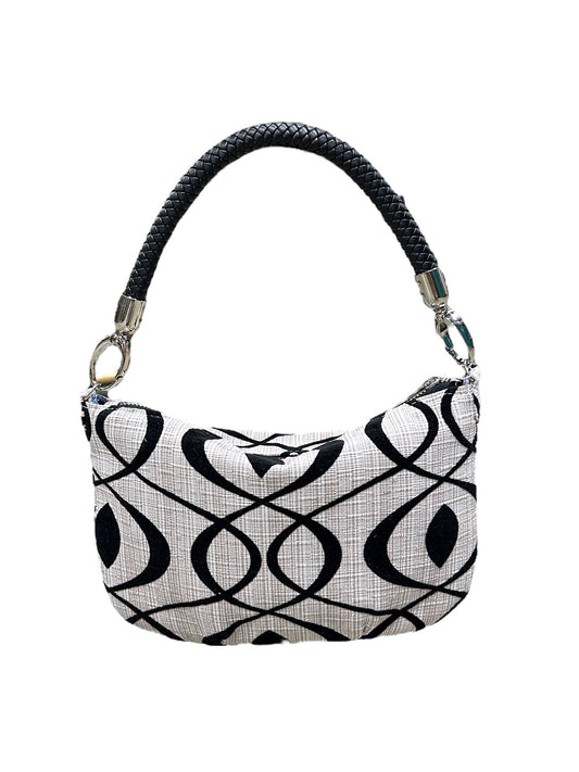 Black and white patterned handbag on a white background