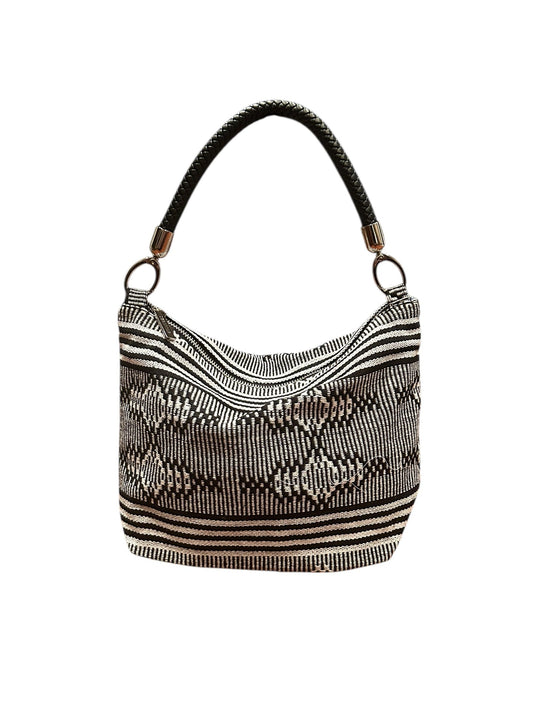 Textured handbag with a pattern on a white background